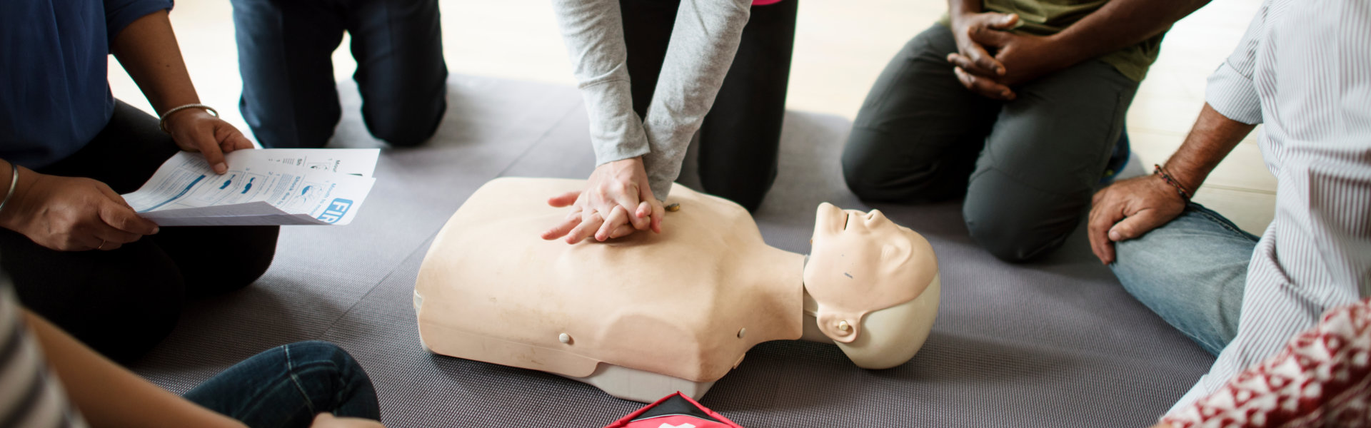 Group of diverse people in cpr training class