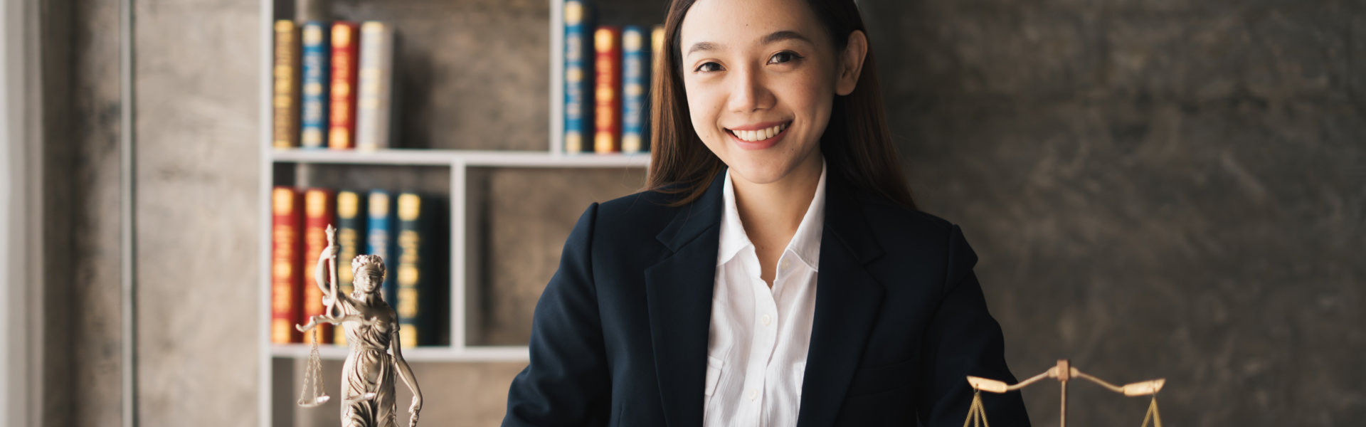 woman in black suit smiling